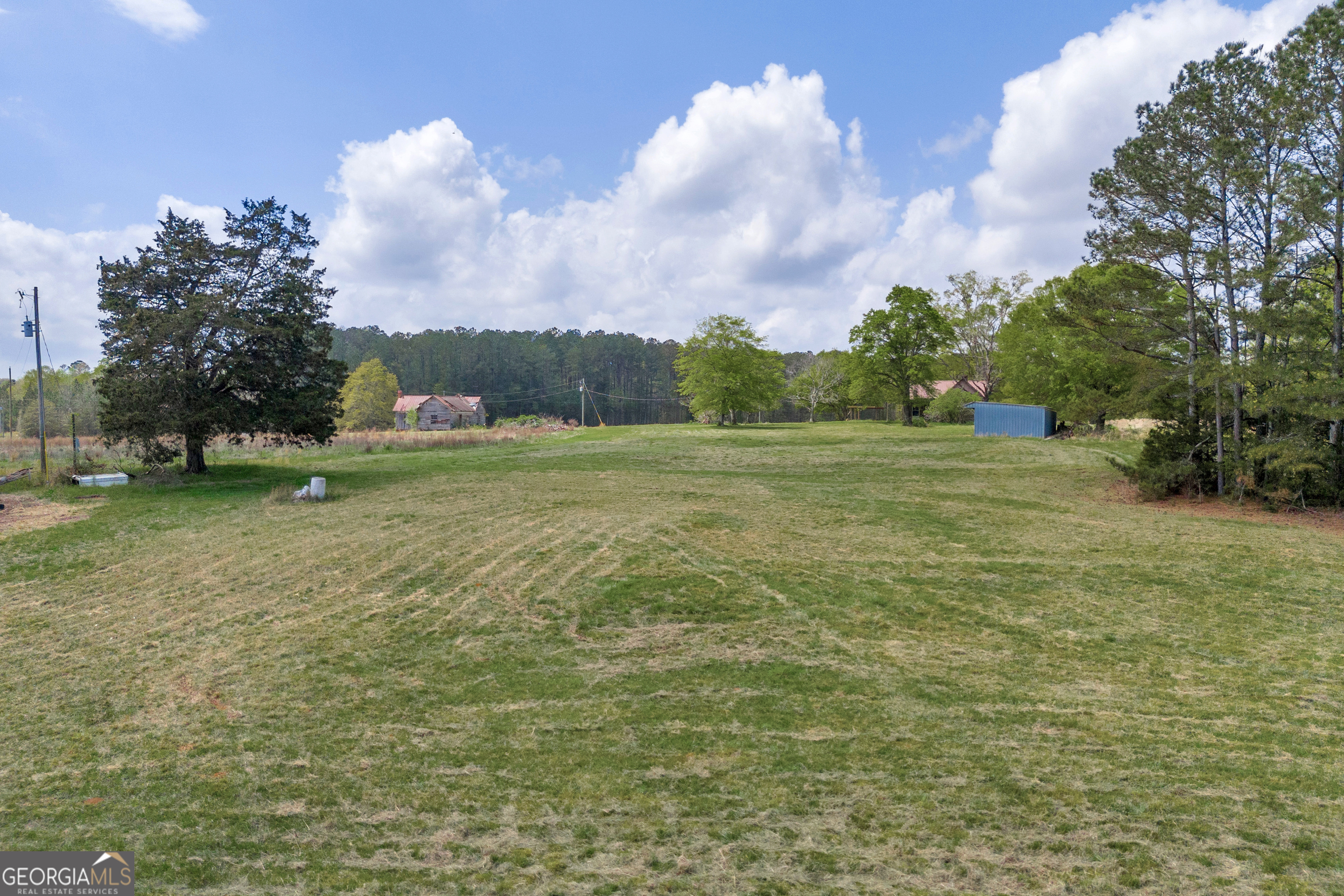 104 Howington Road Winterville, GA 30683 - Photo 60 of 74 a view of field with trees in the background