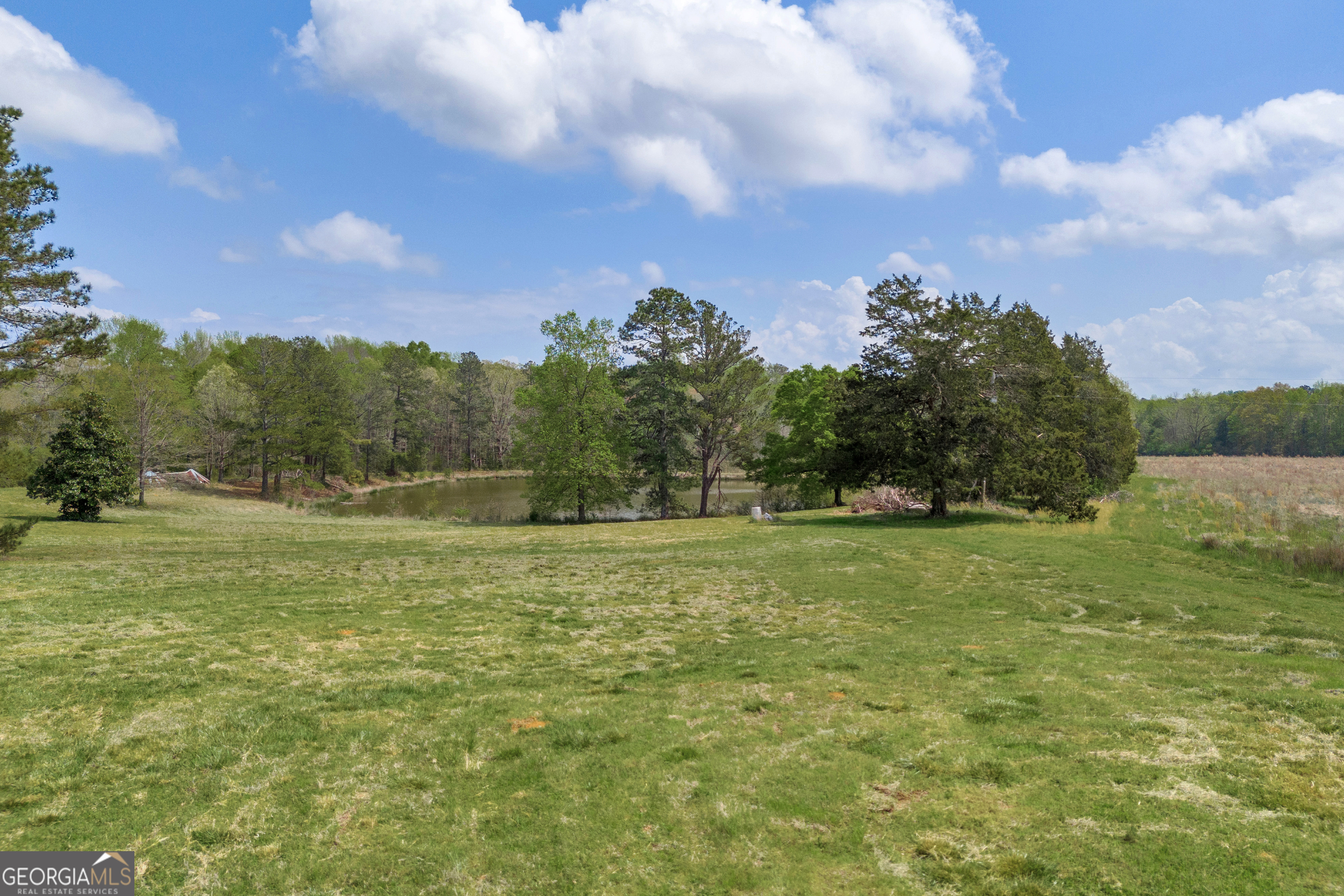 104 Howington Road Winterville, GA 30683 - Photo 63 of 74 a view of a field with an trees