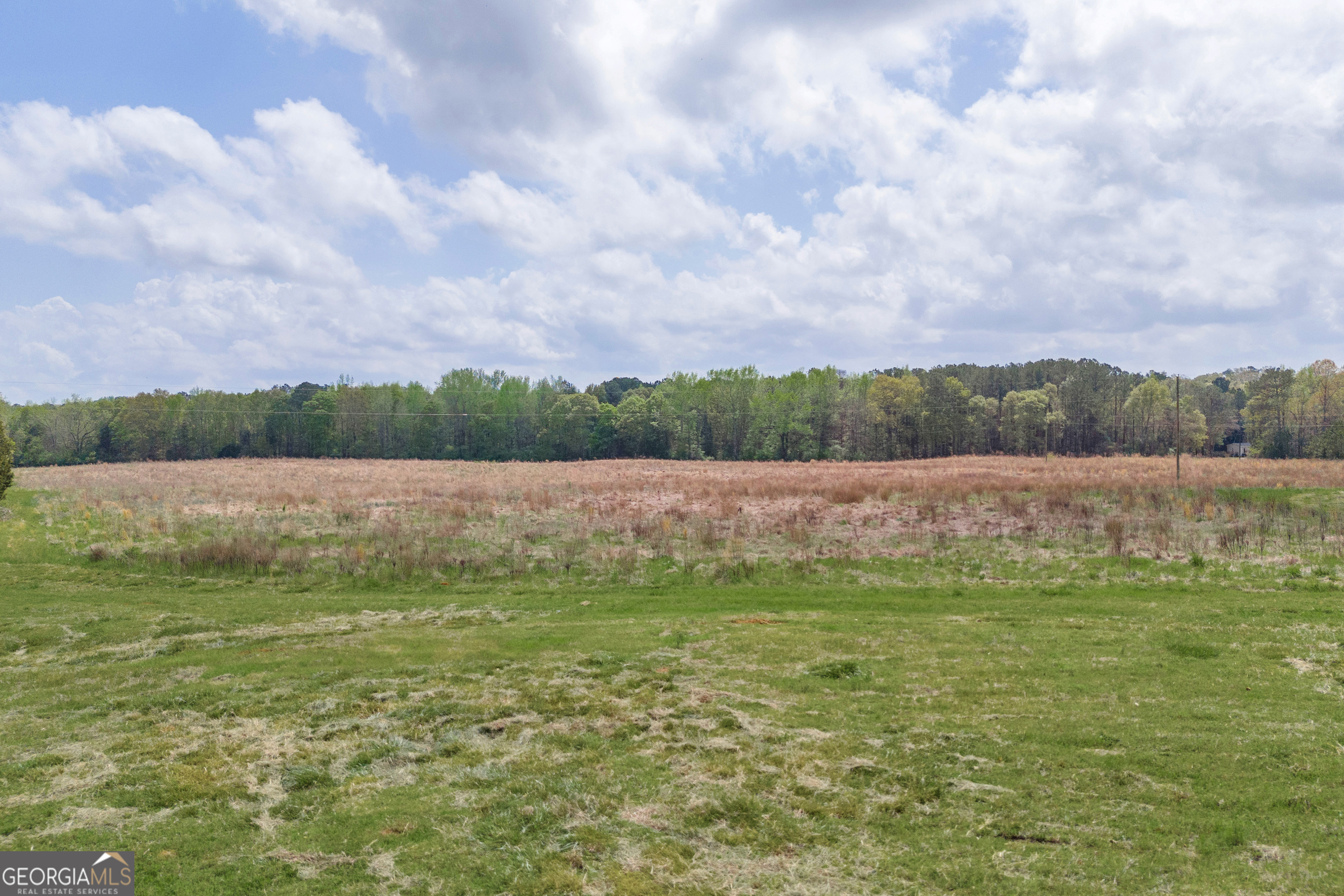 104 Howington Road Winterville, GA 30683 - Photo 64 of 74 a view of a lake with houses in the back