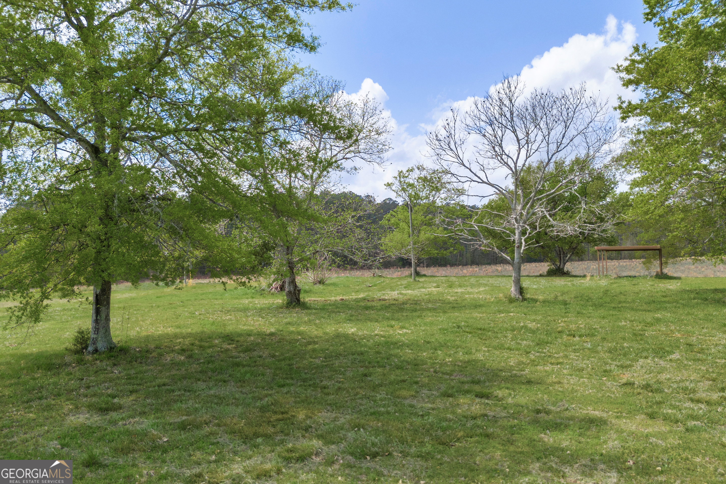 104 Howington Road Winterville, GA 30683 - Photo 65 of 74 a view of field with trees in background