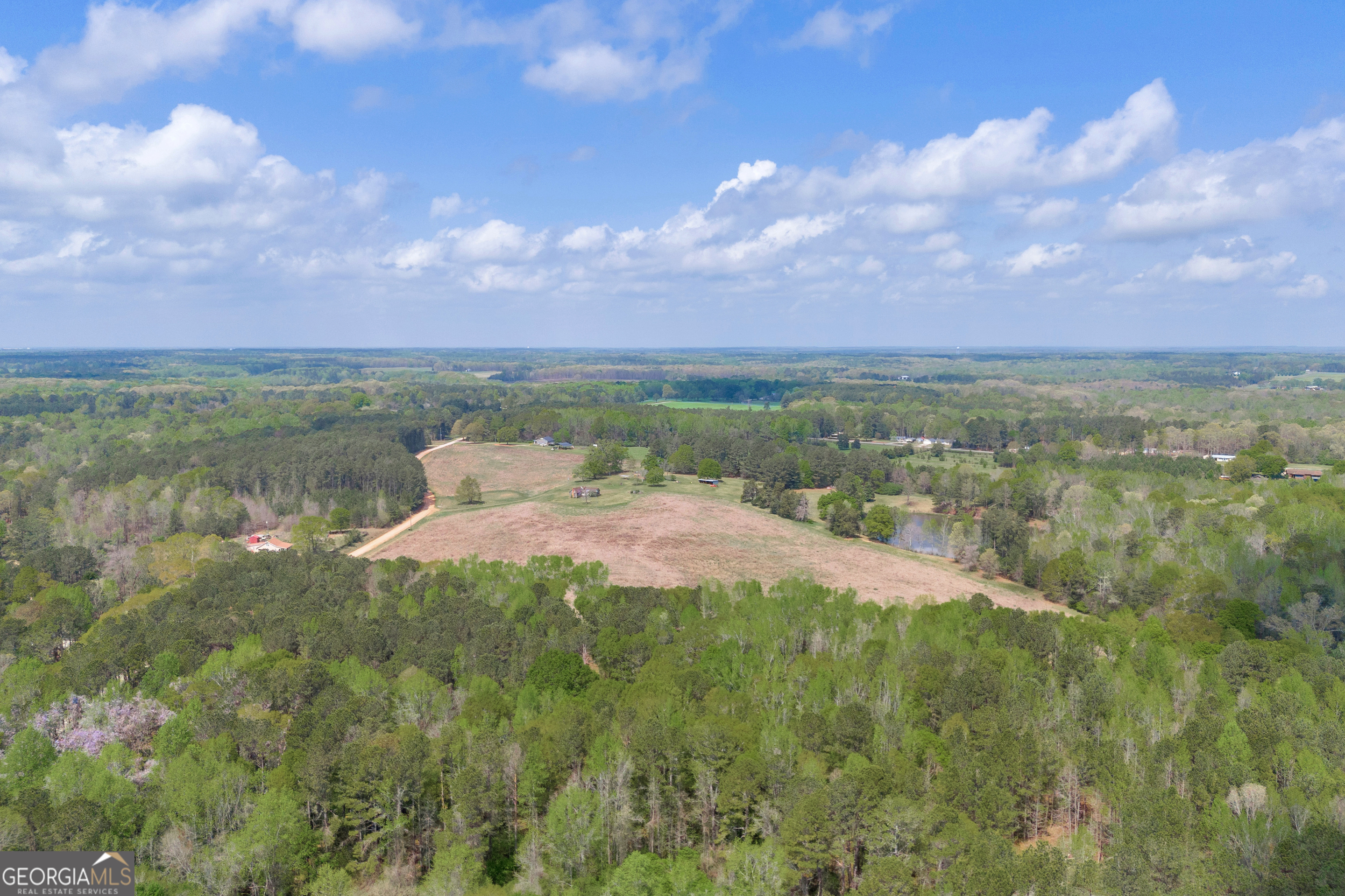 104 Howington Road Winterville, GA 30683 - Photo 10 of 74 a view of a lake with a yard