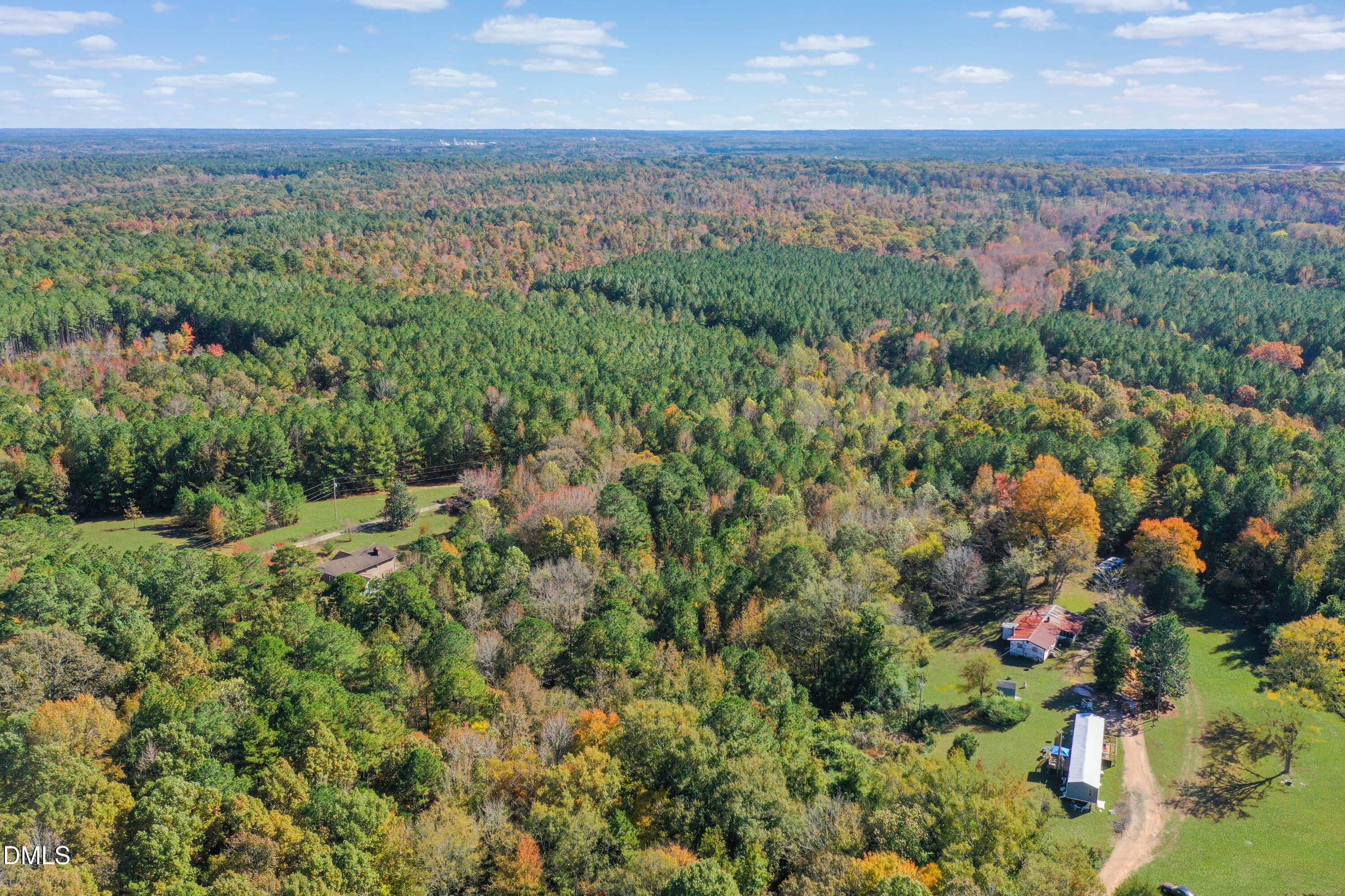 328 John Headen Road Moncure, NC 27559 - Photo 16 of 19 a view of a city with lush green forest