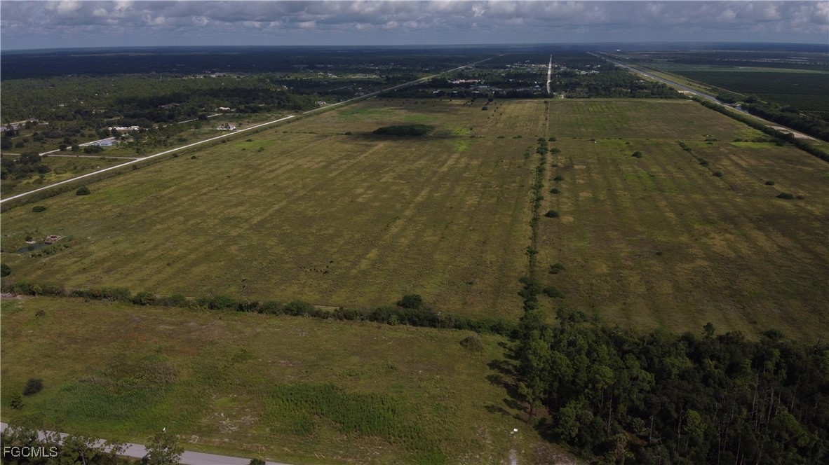 8251 Wheeler Road LaBelle, FL 33935 - Photo 5 of 10 a view of yard with lake and mountain view