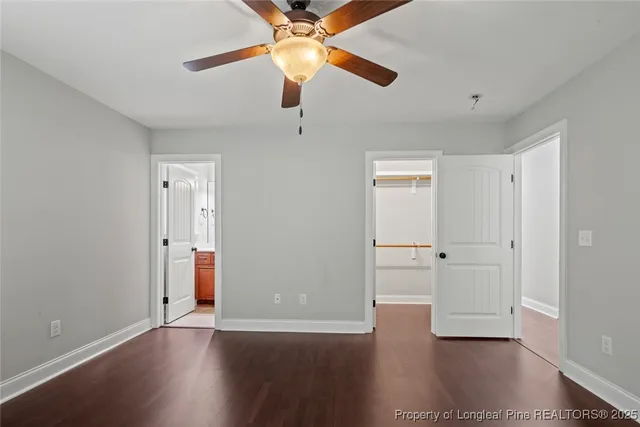 a view of wooden floor and windows in a room