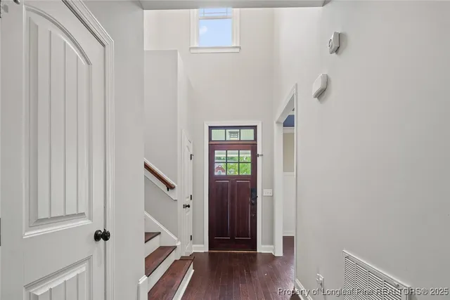 a view of entryway with wooden floor