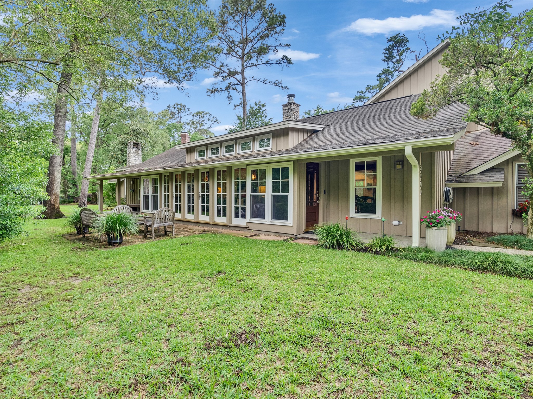 8202 Burkhart Road Houston, TX 77055 - Photo 1 of 29 The front of the home with its many windows and french doors.
