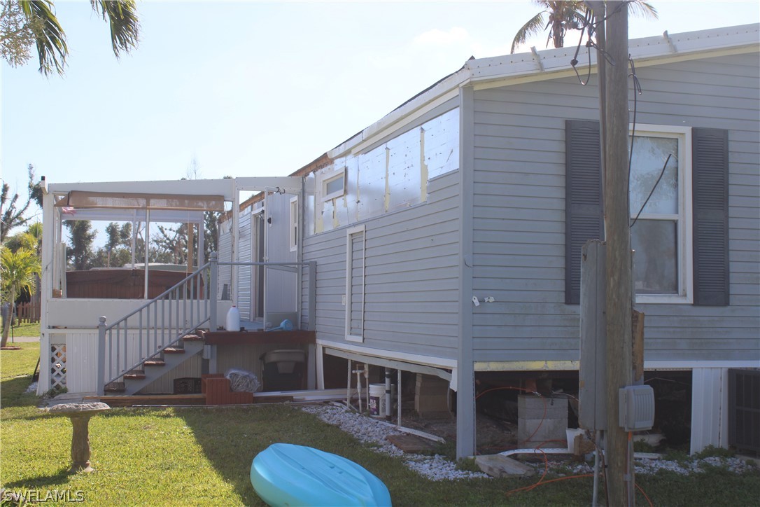 5470 Rainbow Drive Bokeelia, FL 33922 - Photo 1 of 21 a view of a house with a swimming pool