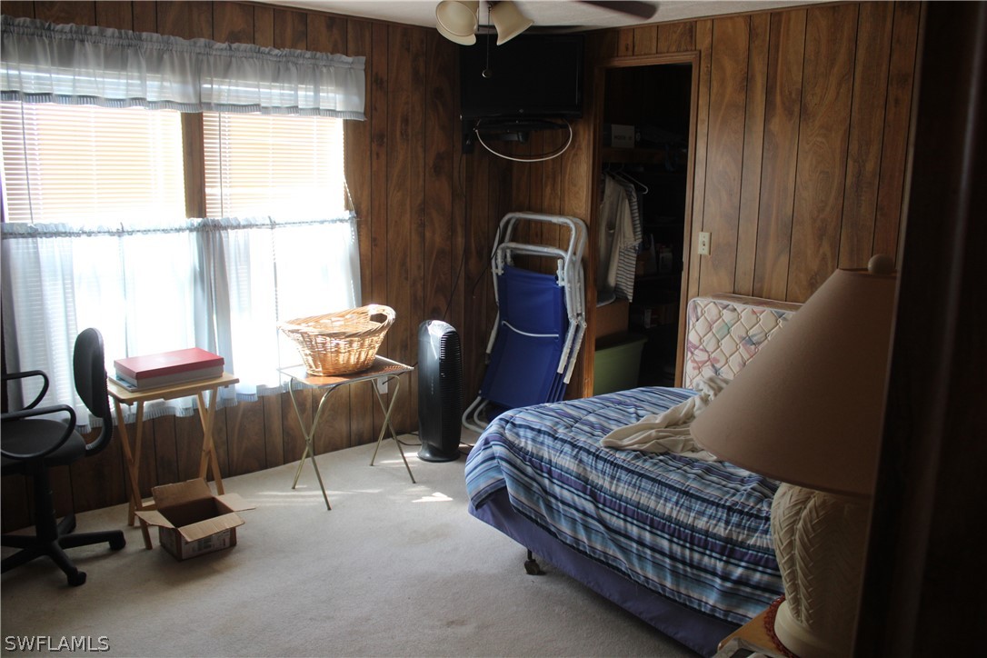 5470 Rainbow Drive Bokeelia, FL 33922 - Photo 12 of 21 a bedroom with a bed and a window