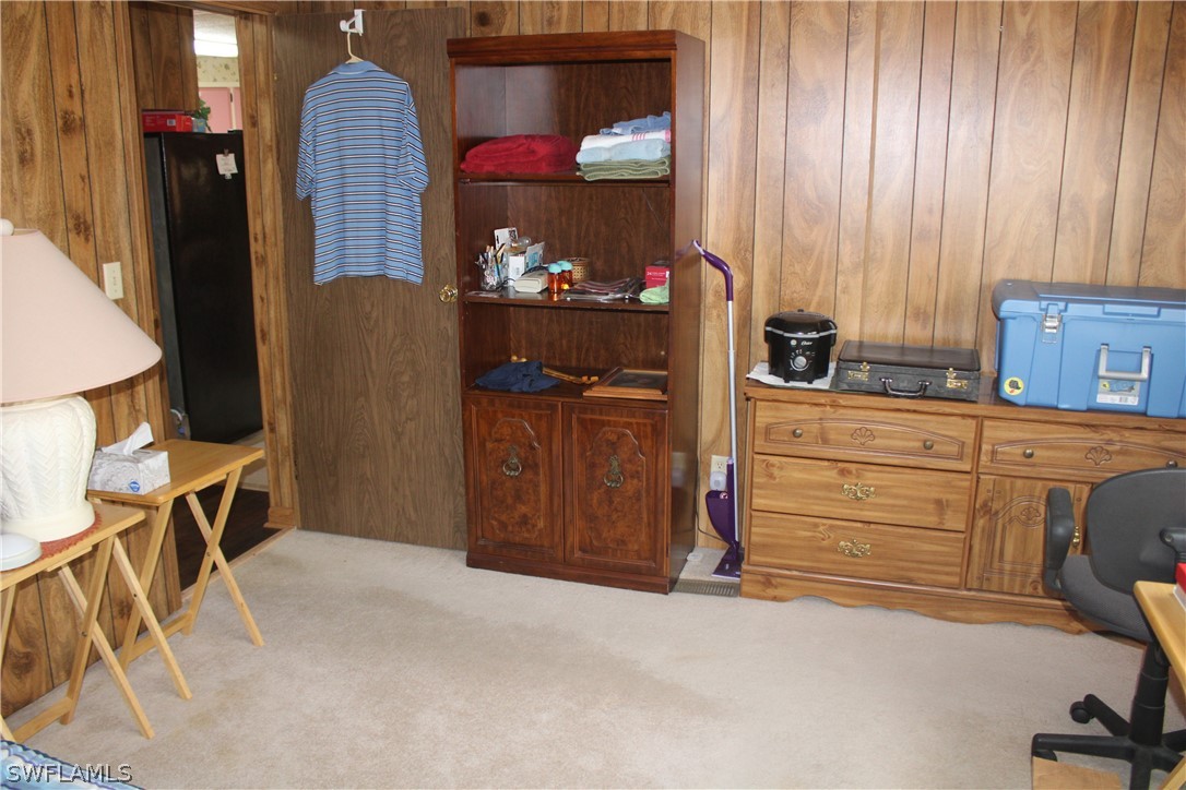 5470 Rainbow Drive Bokeelia, FL 33922 - Photo 15 of 21 a room with furniture and cabinets