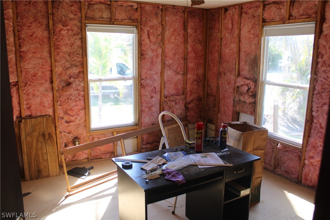 5470 Rainbow Drive Bokeelia, FL 33922 - Photo 18 of 21 a living room with furniture and a window