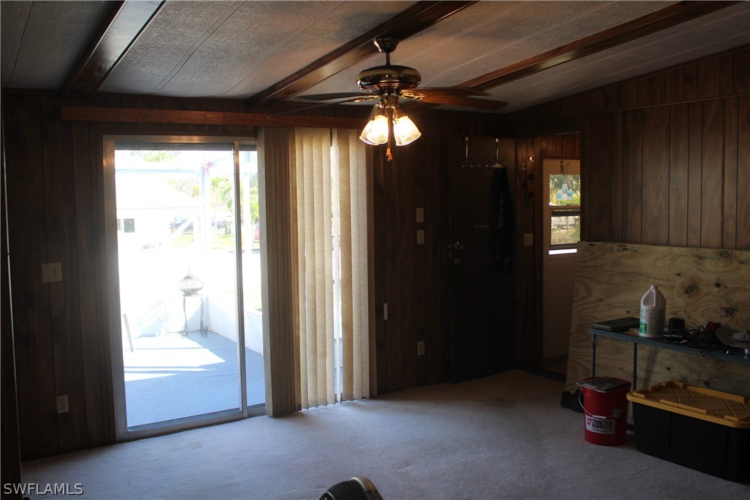 5470 Rainbow Drive Bokeelia, FL 33922 - Photo 20 of 21 a view of a livingroom with furniture and windows