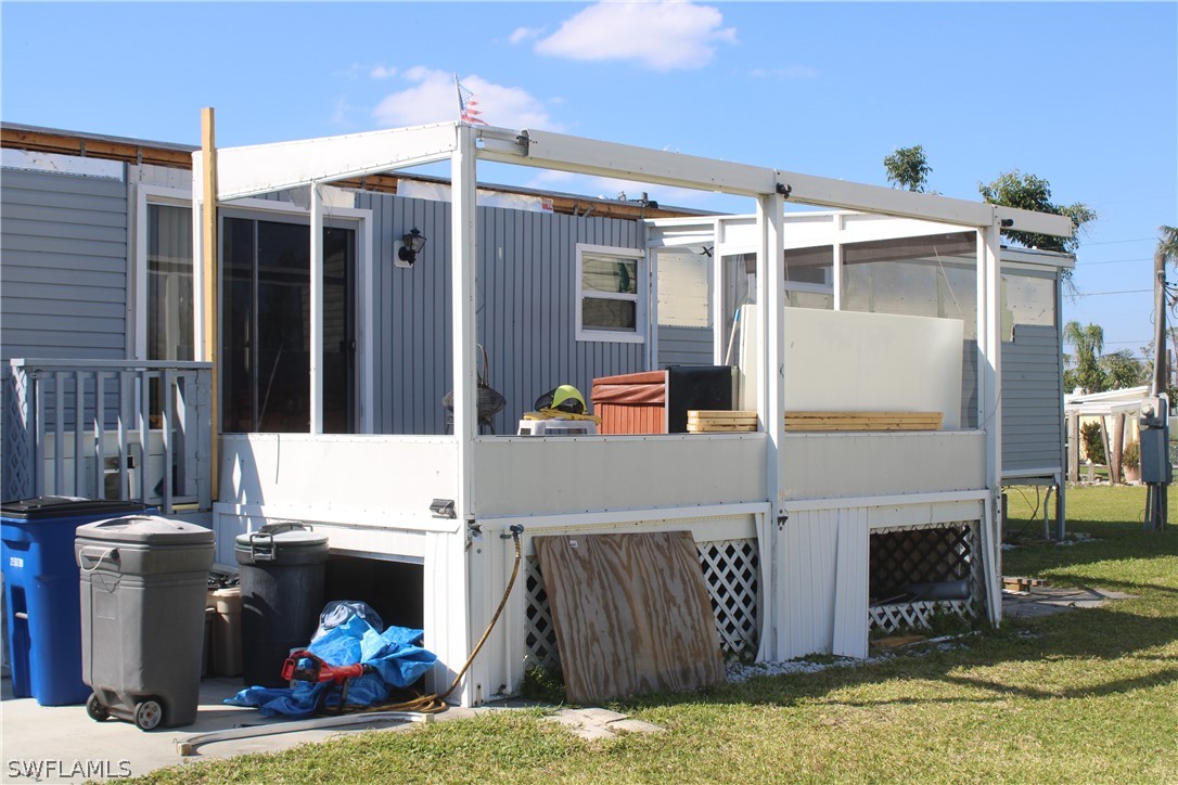 5470 Rainbow Drive Bokeelia, FL 33922 - Photo 5 of 21 a front view of house with yard