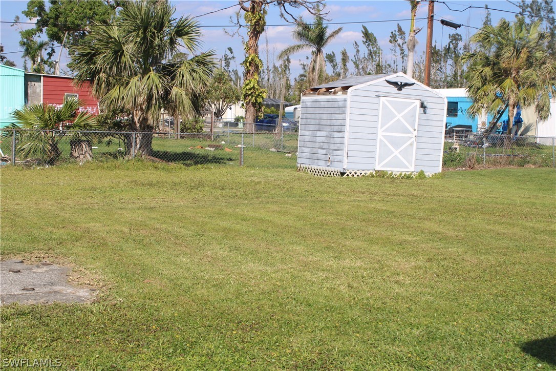 5470 Rainbow Drive Bokeelia, FL 33922 - Photo 6 of 21 a view of a house with a yard