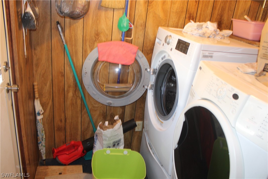 5470 Rainbow Drive Bokeelia, FL 33922 - Photo 9 of 21 a utility room with dryer and washer