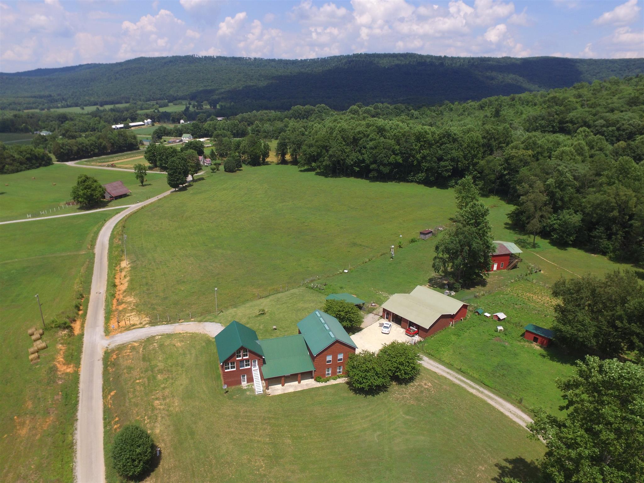 429 Williams Road Morrison, TN 37357 - Photo 1 of 30 an aerial view of a house with a yard and lake view