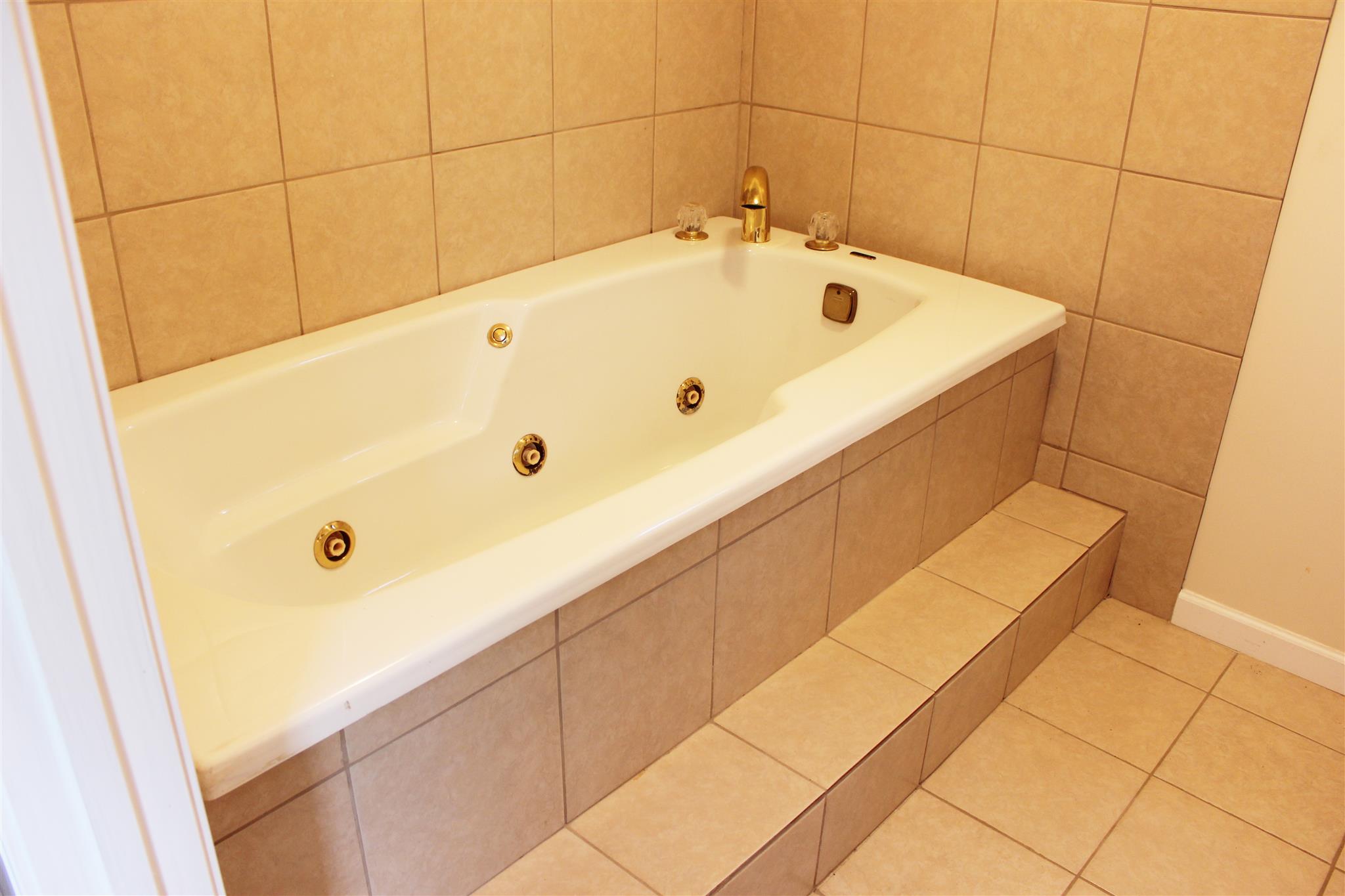 429 Williams Road Morrison, TN 37357 - Photo 16 of 30 a bathroom with a tub and shower