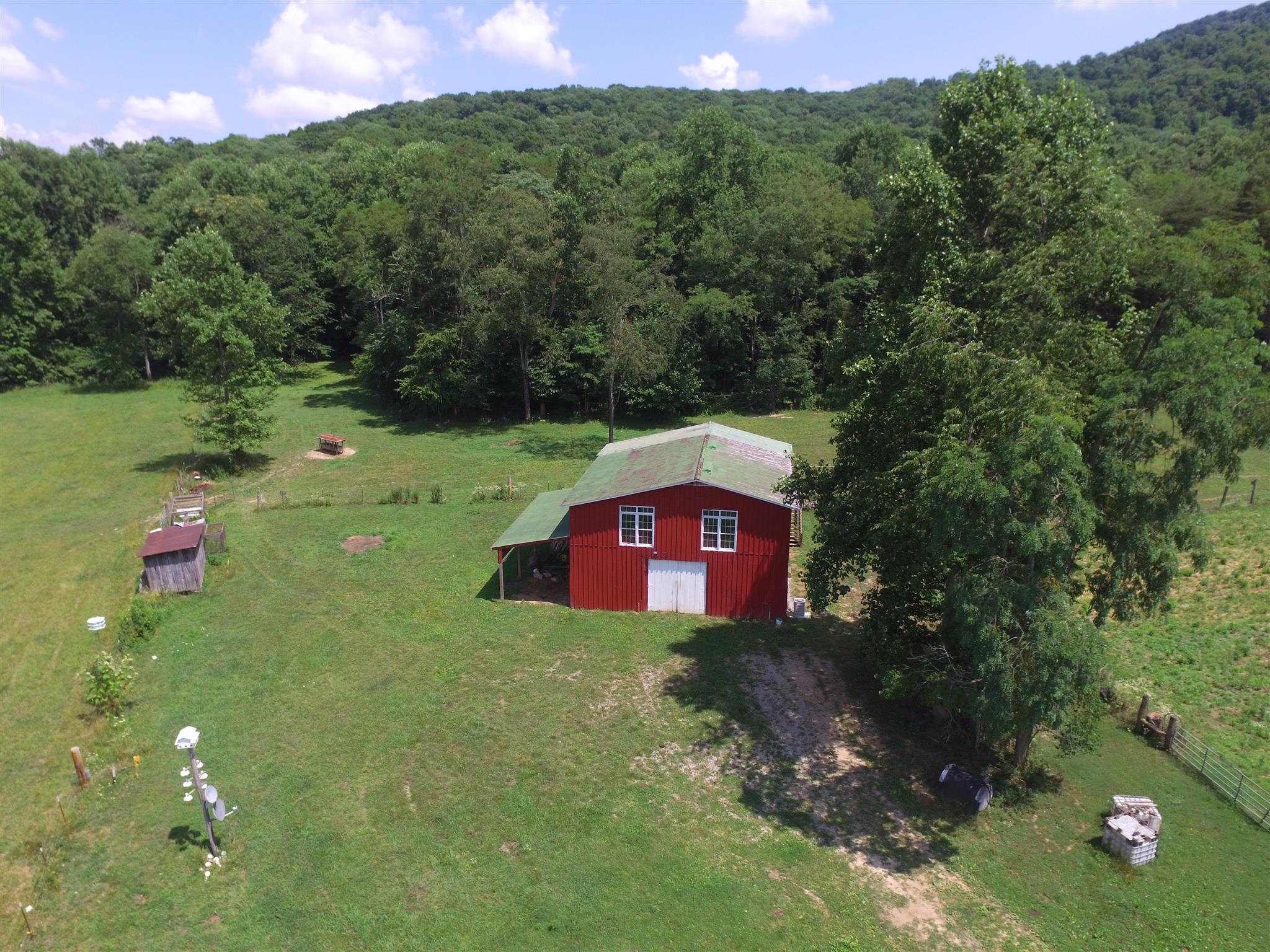 429 Williams Road Morrison, TN 37357 - Photo 26 of 30 a view of a lush green forest with a house in the background
