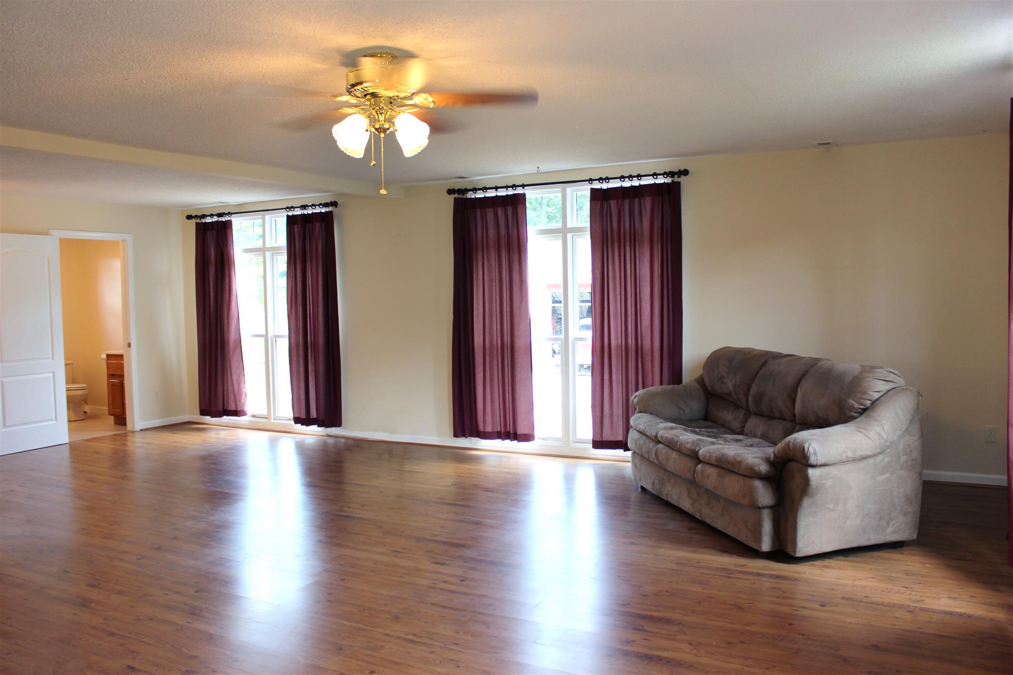 429 Williams Road Morrison, TN 37357 - Photo 5 of 30 a living room with couches and potted plant with wooden floor