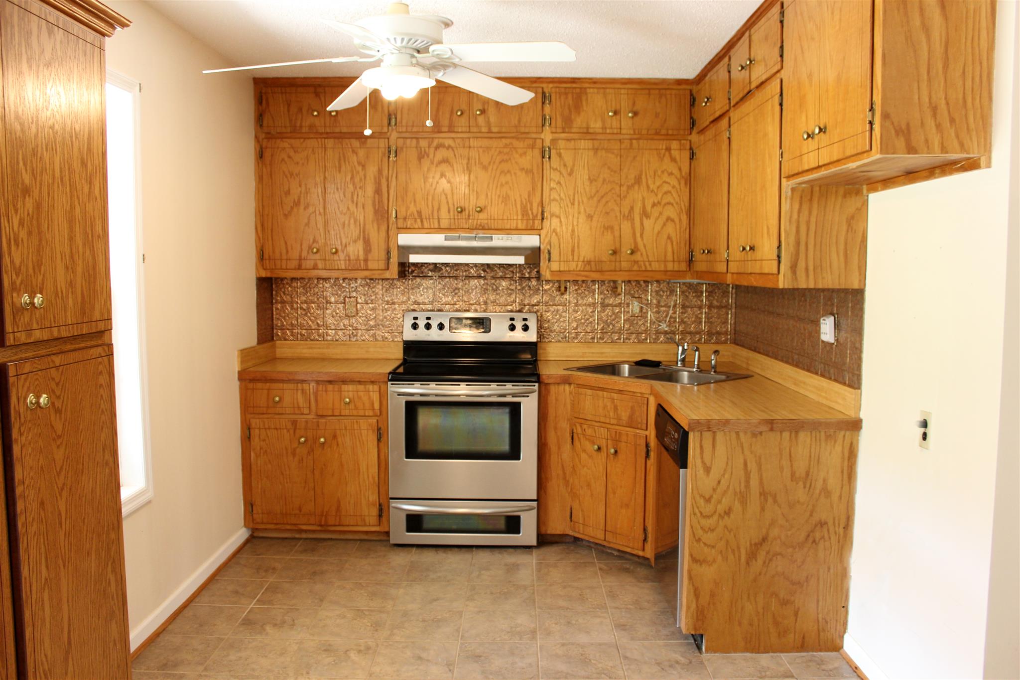 429 Williams Road Morrison, TN 37357 - Photo 7 of 30 a kitchen with stainless steel appliances granite countertop a stove a sink and a refrigerator