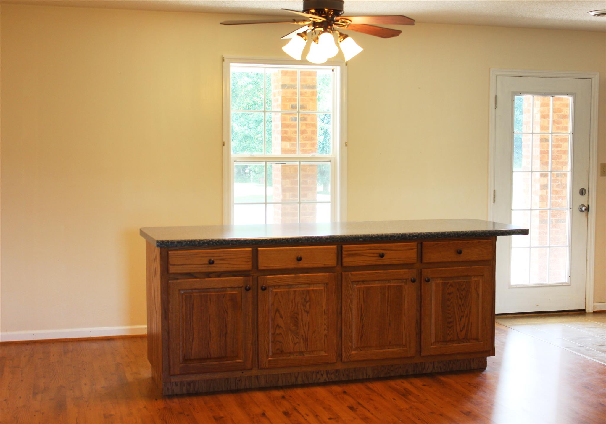 429 Williams Road Morrison, TN 37357 - Photo 8 of 30 a view of an empty room with wooden floor and a window