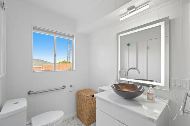 a living room with furniture and next to a window