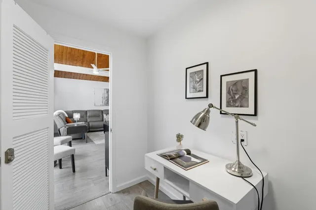 a bedroom with two beds and a window