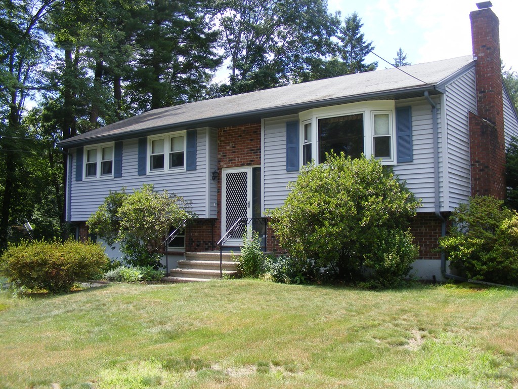 4 Edgar Road Billerica, MA 01821 - Photo 2 of 6 a front view of a house with a yard