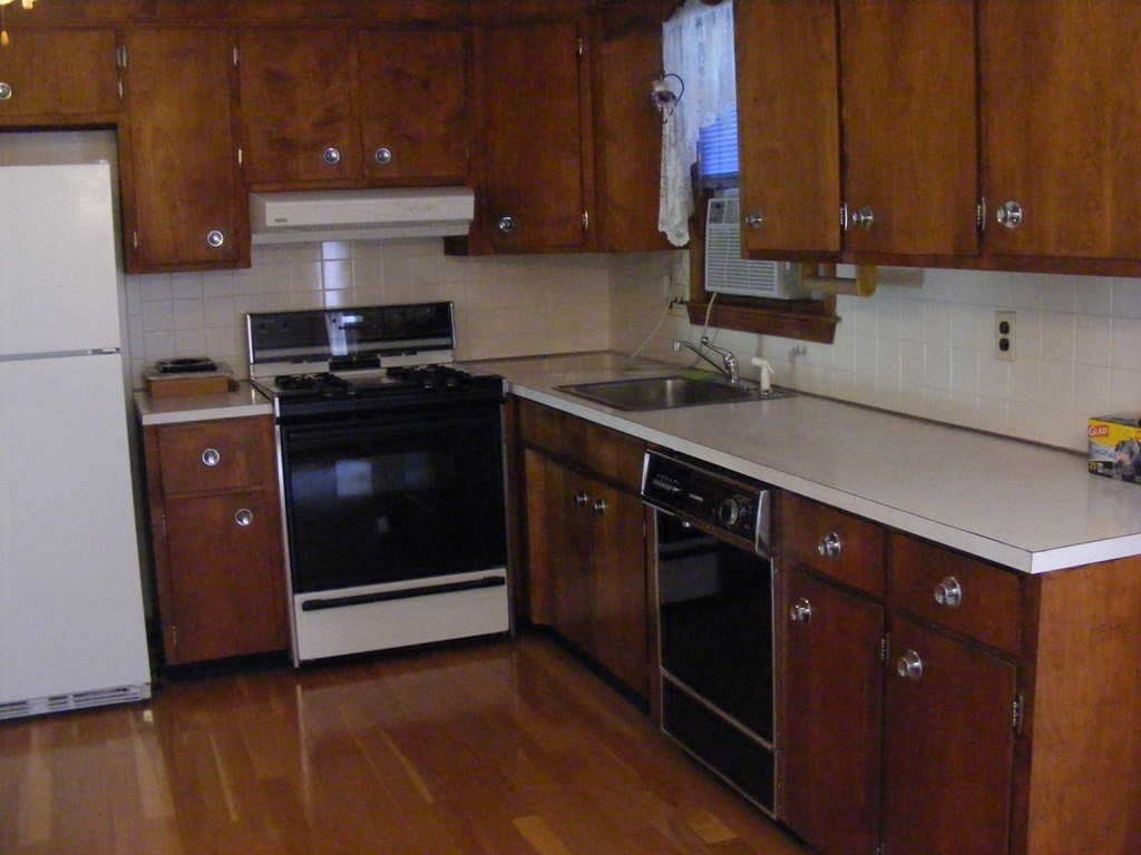 4 Edgar Road Billerica, MA 01821 - Photo 4 of 6 a kitchen with a sink and a stove top oven