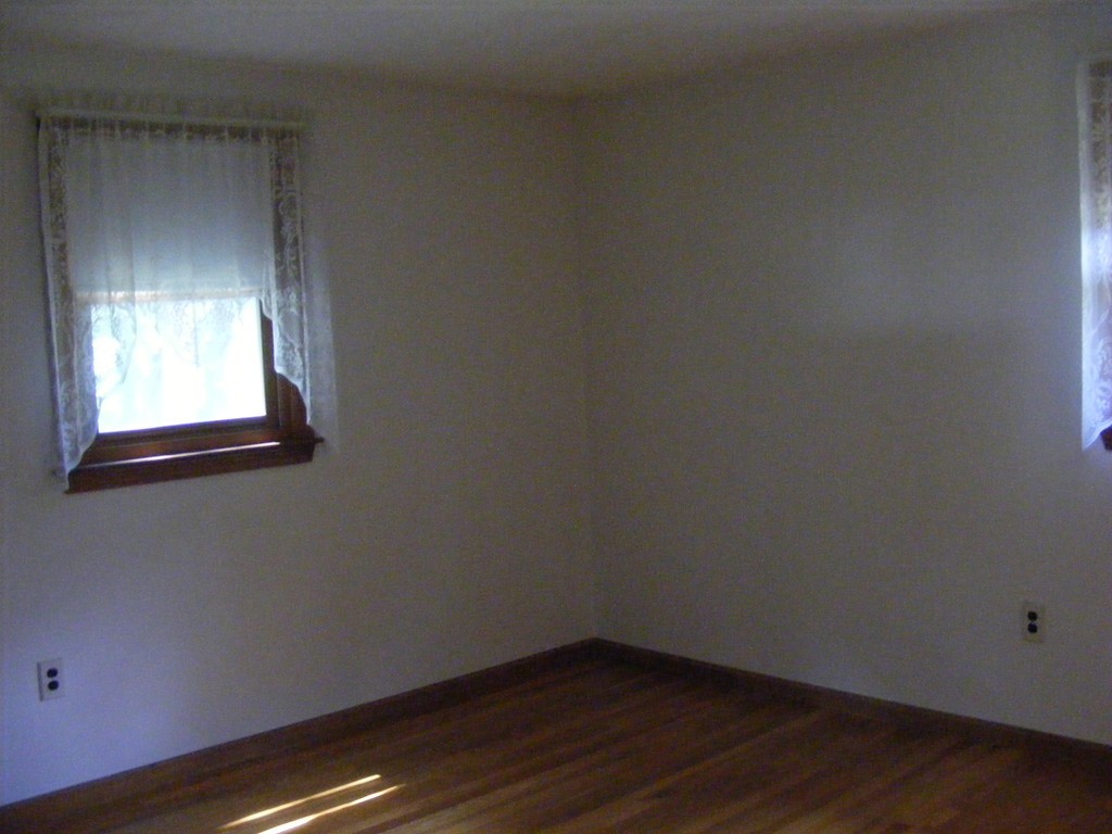 4 Edgar Road Billerica, MA 01821 - Photo 5 of 6 a view of a small space with wooden floor and a window