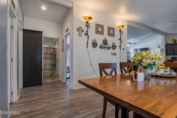 a view of a dining room with furniture and wooden floor
