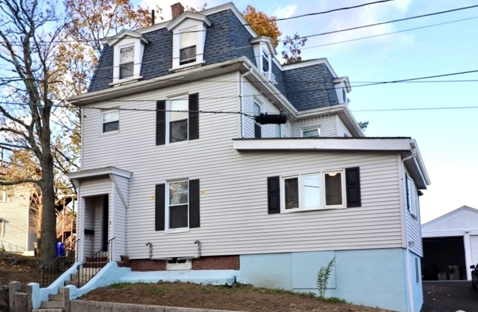 a view of a house with a garage