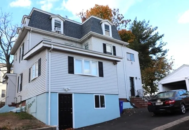 a view of a car park in front of house