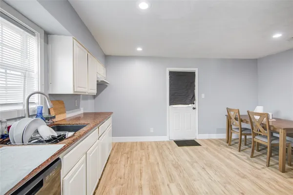 a kitchen with a sink and cabinets