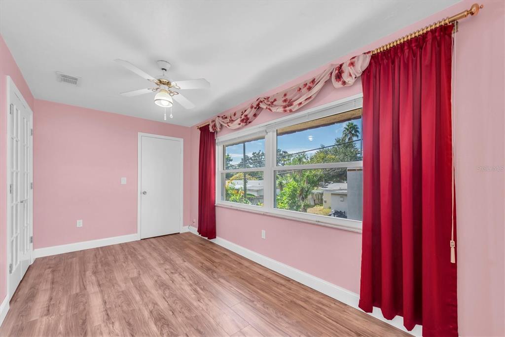 10032 65th Avenue North, Unit 24 St. Petersburg, FL 33708 - Photo 17 of 56 a view of an empty room with a window