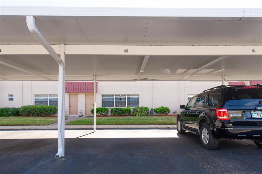 10032 65th Avenue North, Unit 24 St. Petersburg, FL 33708 - Photo 26 of 56 a view of car parked in garage
