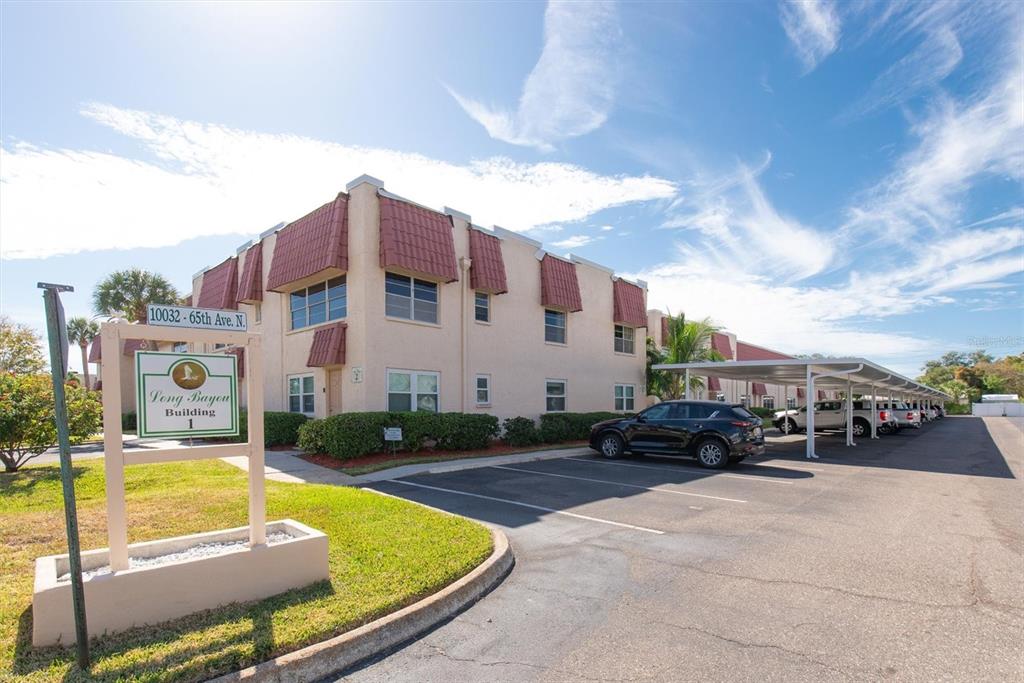 10032 65th Avenue North, Unit 24 St. Petersburg, FL 33708 - Photo 27 of 56 a view of multiple house with swimming pool