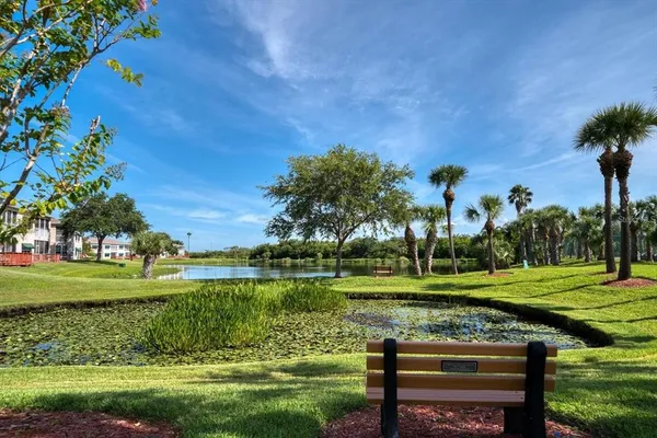 a view of a golf course with a lake view