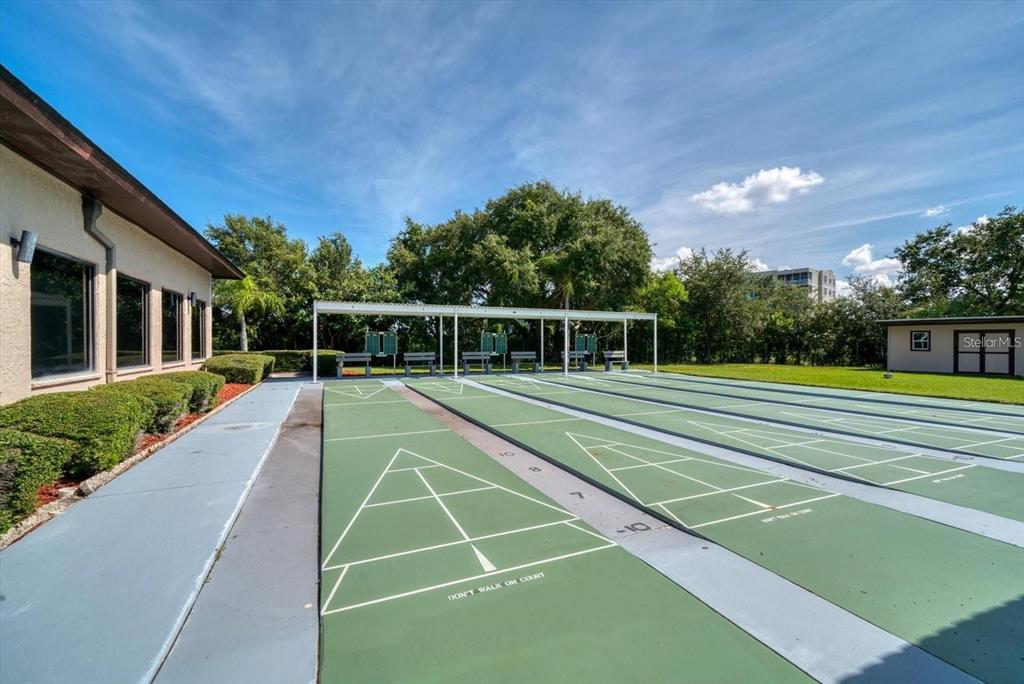 10032 65th Avenue North, Unit 24 St. Petersburg, FL 33708 - Photo 48 of 56 a view of a tennis court