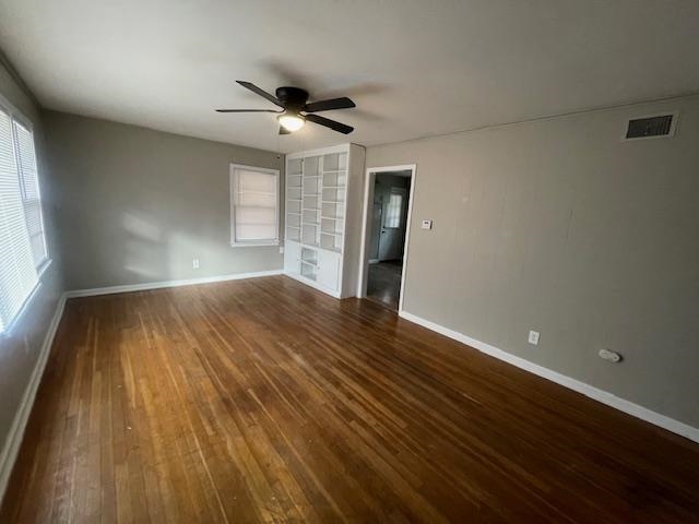 3602 Hallbrook Street Memphis, TN 38127 - Photo 5 of 12 Spare room with dark wood-style floors and a ceiling fan