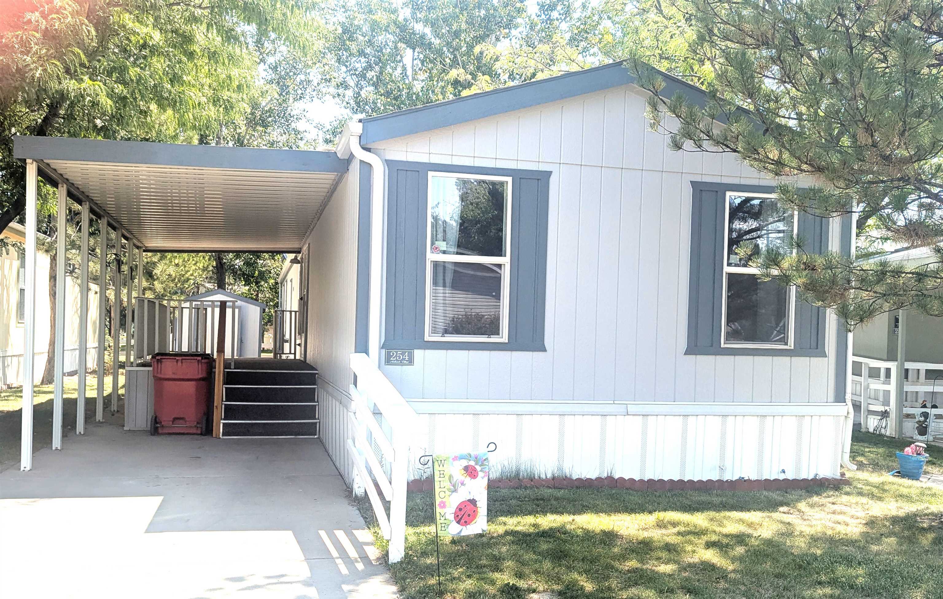 a view of house with yard outdoor seating and barbeque oven