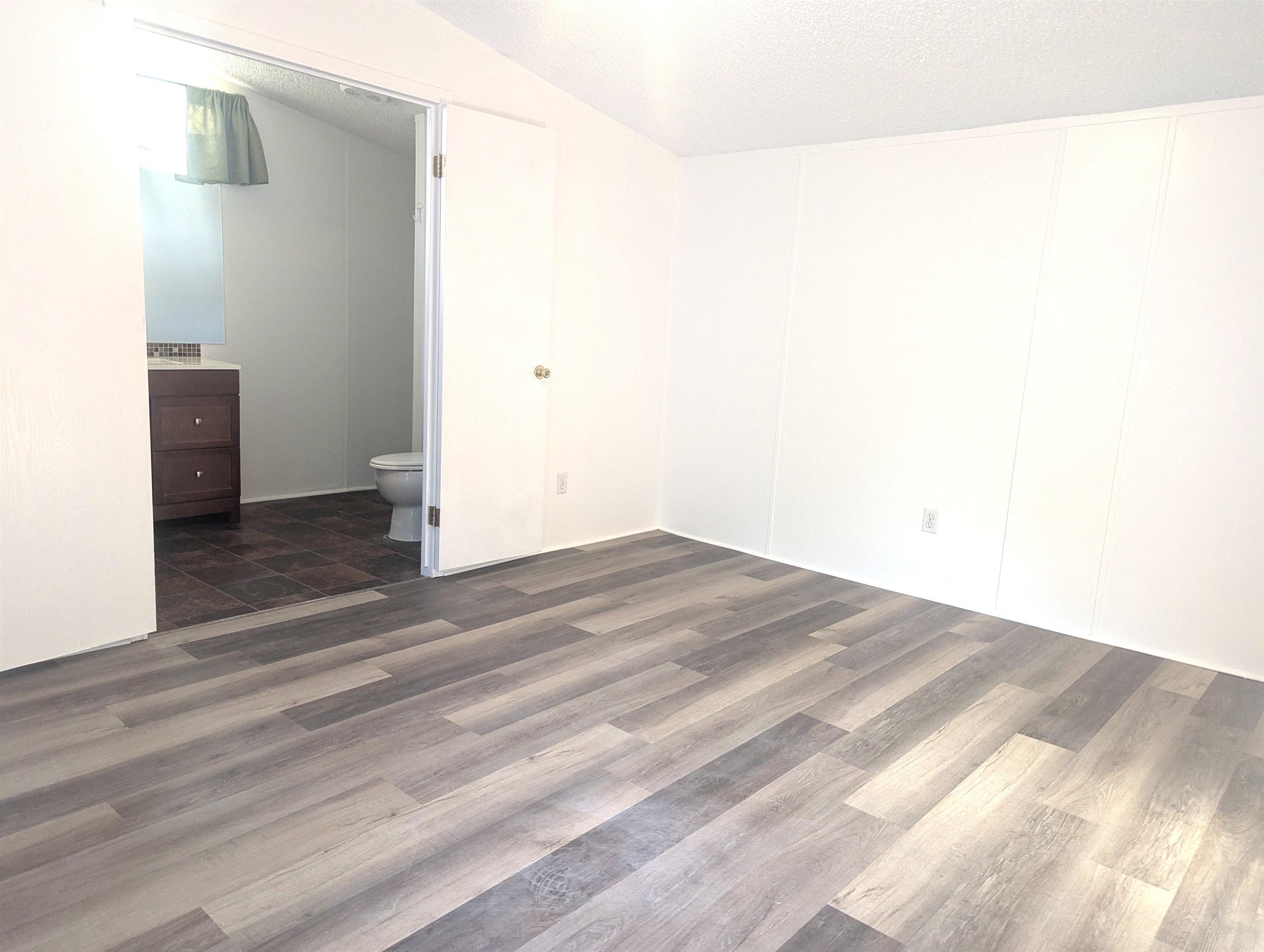 435 32 Road, Unit 254 Clifton, CO 81520 - Photo 16 of 21 a view of a room with wooden floor