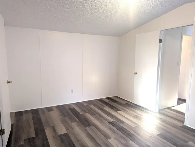 an empty room with wooden floor