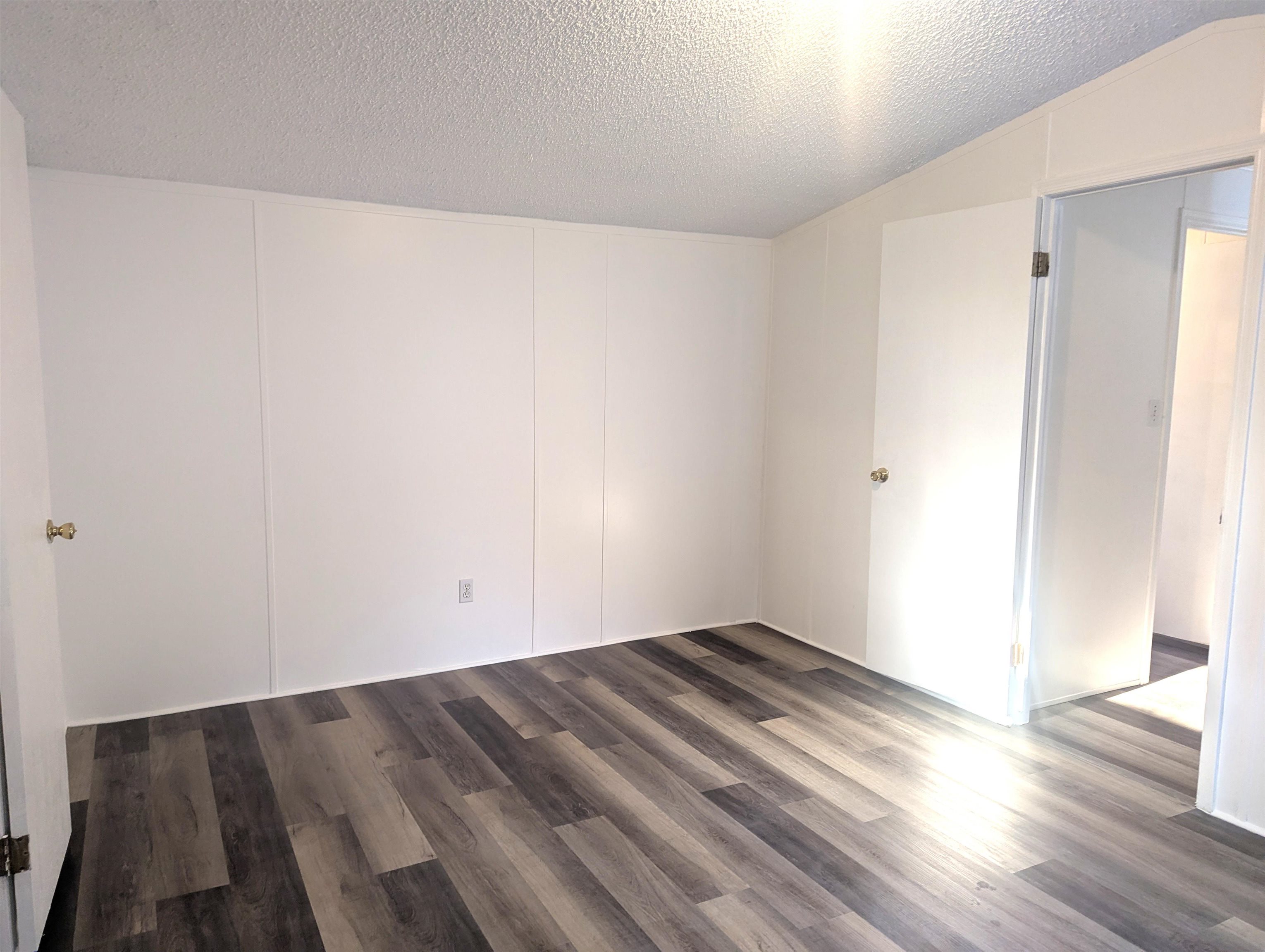 435 32 Road, Unit 254 Clifton, CO 81520 - Photo 17 of 21 an empty room with wooden floor