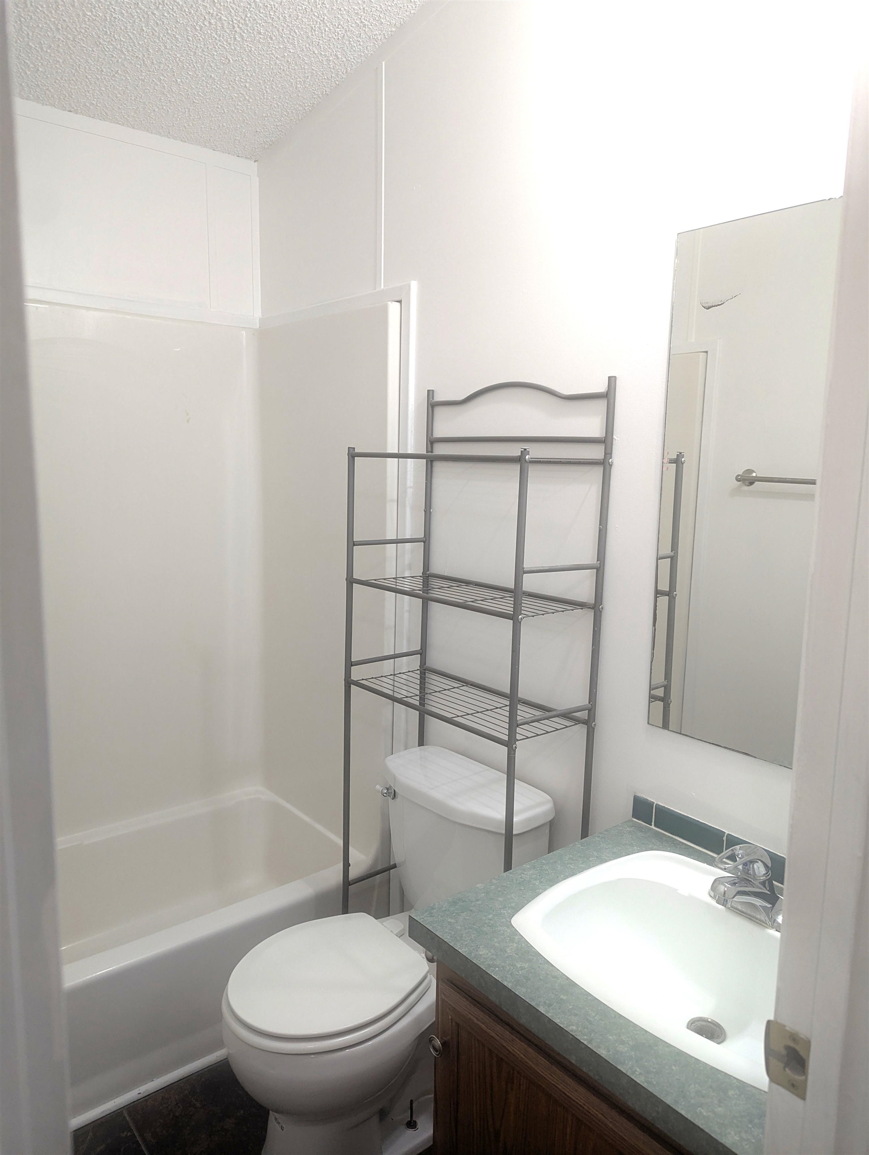 435 32 Road, Unit 254 Clifton, CO 81520 - Photo 19 of 21 a bathroom with a sink toilet and shower