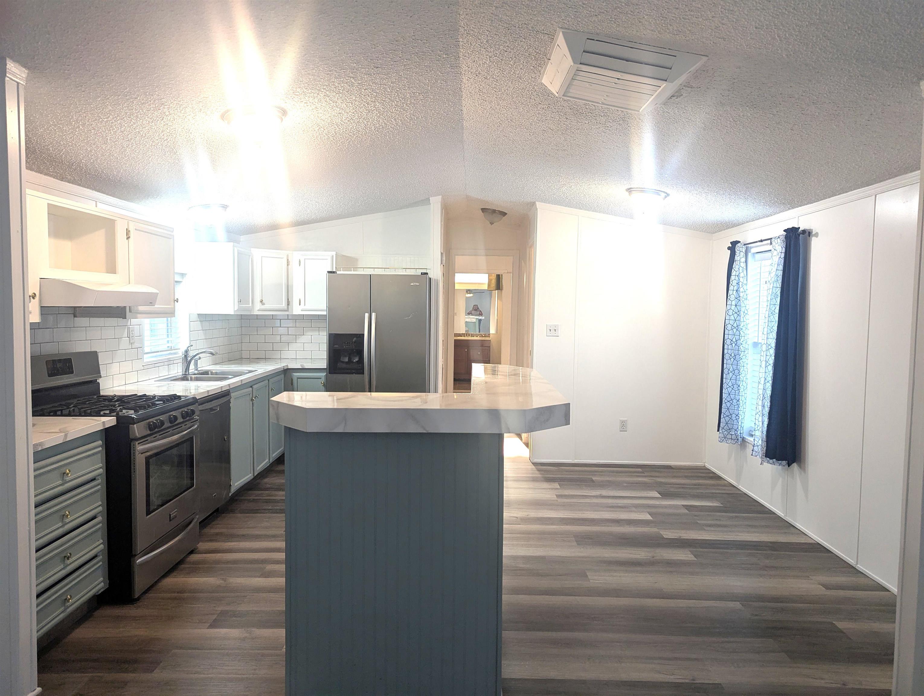 435 32 Road, Unit 254 Clifton, CO 81520 - Photo 2 of 21 a kitchen with stainless steel appliances a stove refrigerator and cabinets