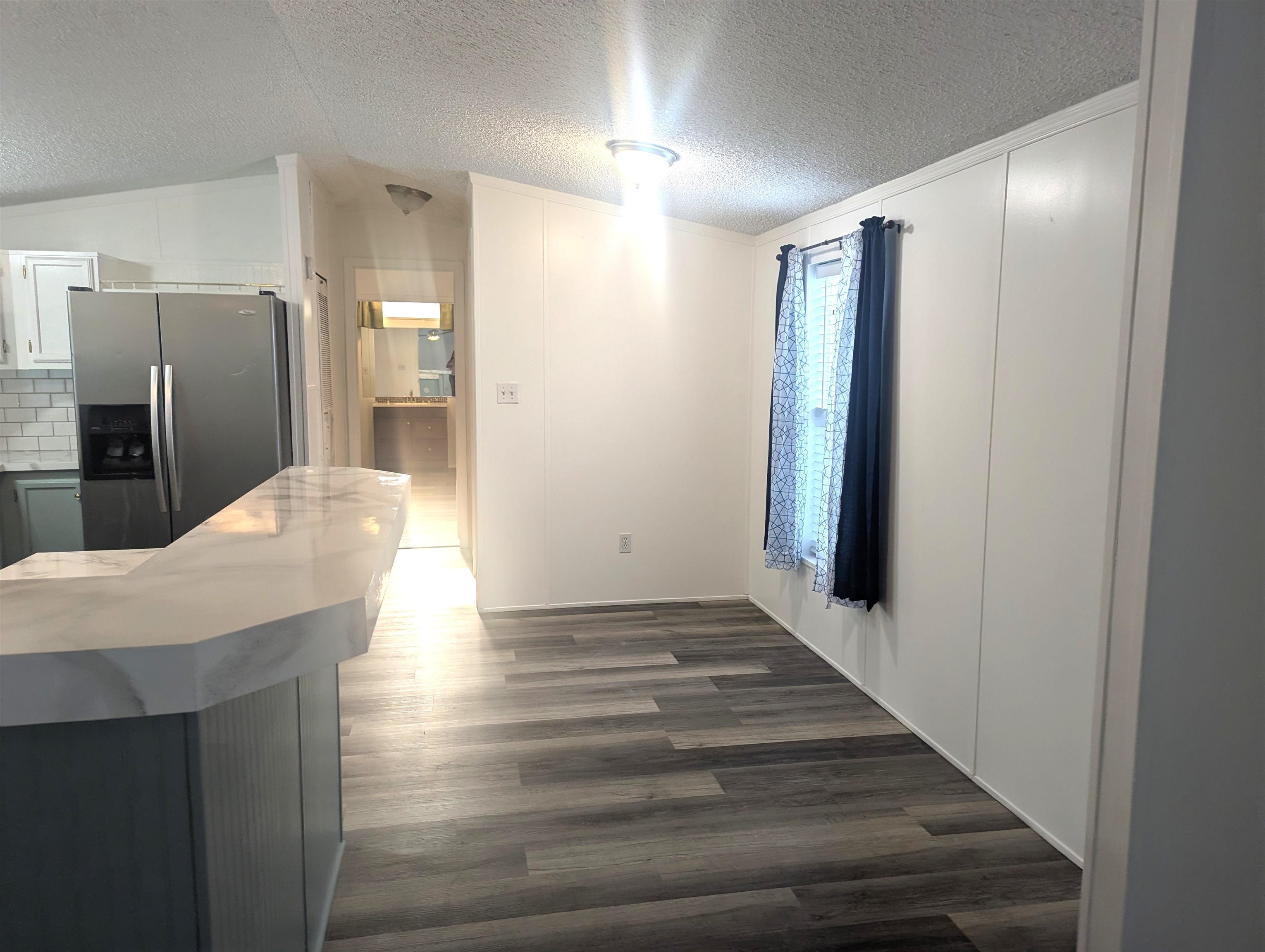 435 32 Road, Unit 254 Clifton, CO 81520 - Photo 7 of 21 a view of a hallway with wooden floor