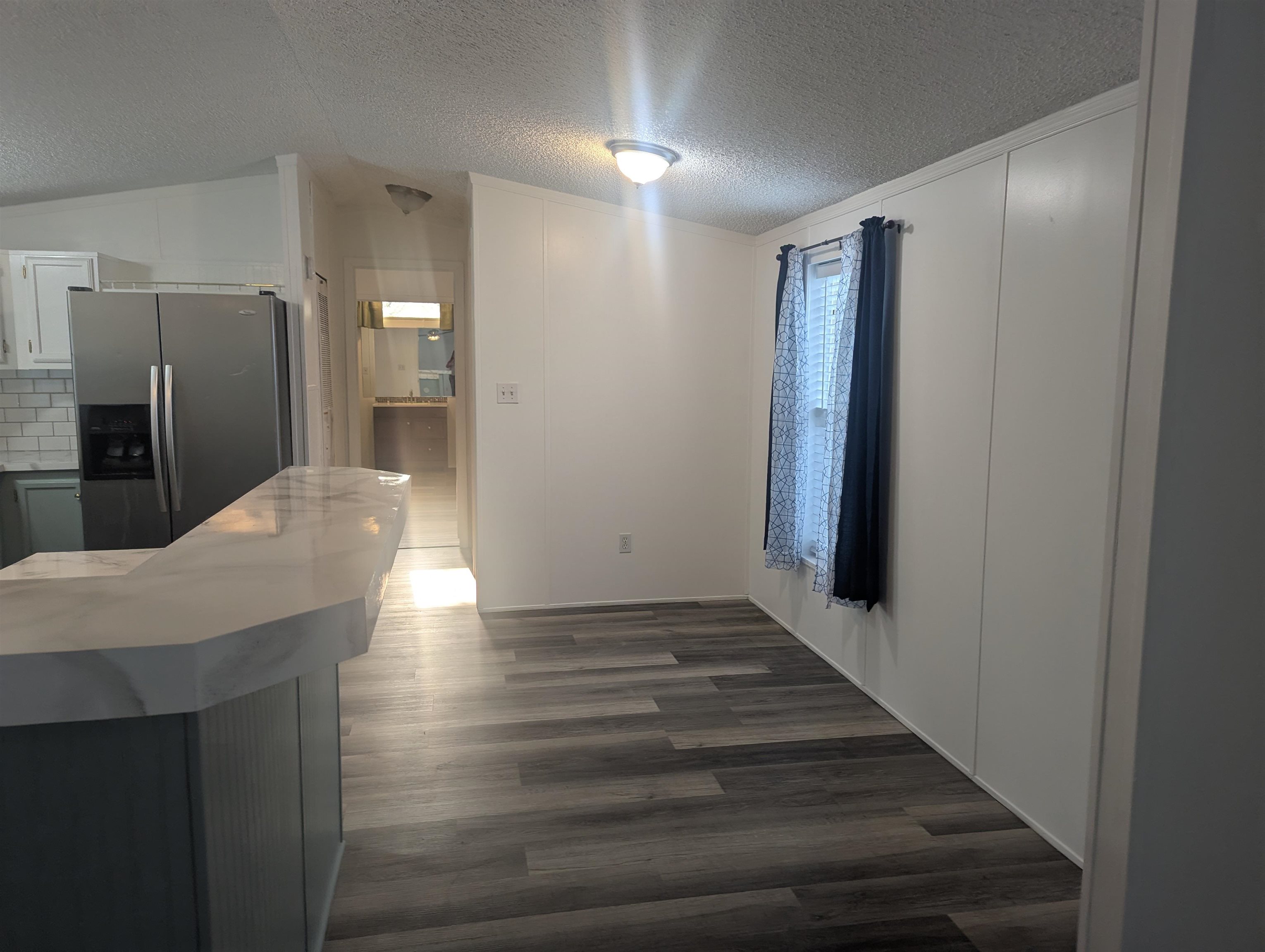 435 32 Road, Unit 254 Clifton, CO 81520 - Photo 8 of 21 a view of a hallway with wooden floor
