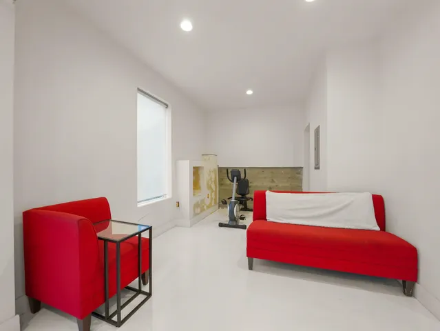 a bedroom with furniture and a couch