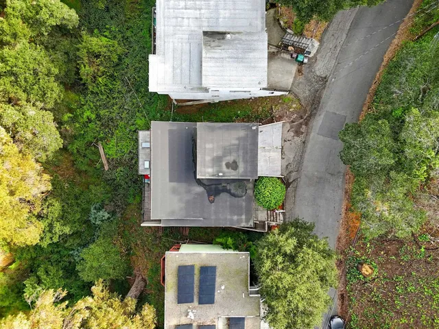 an aerial view of a house with outdoor space