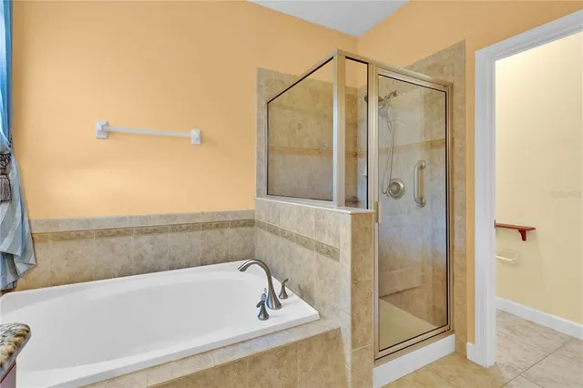 a bathroom with a bathtub and a shower